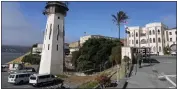  ?? ERIC RISBERG — THE ASSOCIATED PRESS ?? A correction­al officer walks up a main entryway during a media tour at San Quentin State Prison in San Quentin on July 26.