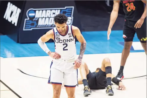  ?? Robert Franklin / Associated Press ?? UConn’s James Bouknight reacts late in the second half of the Huskies’ 63-54 loss to Maryland in their first-round NCAA Tournament game Saturday in West Lafayette, Ind.