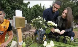  ??  ?? PAIN: Jake and Danielle at their son’s grave. Left: Jake playing for Hull