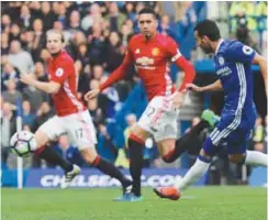  ??  ?? Pedro (right) scores Chelsea’s first goal during Sunday’s English Premier League match against Manchester United at Stamford Bridge. –