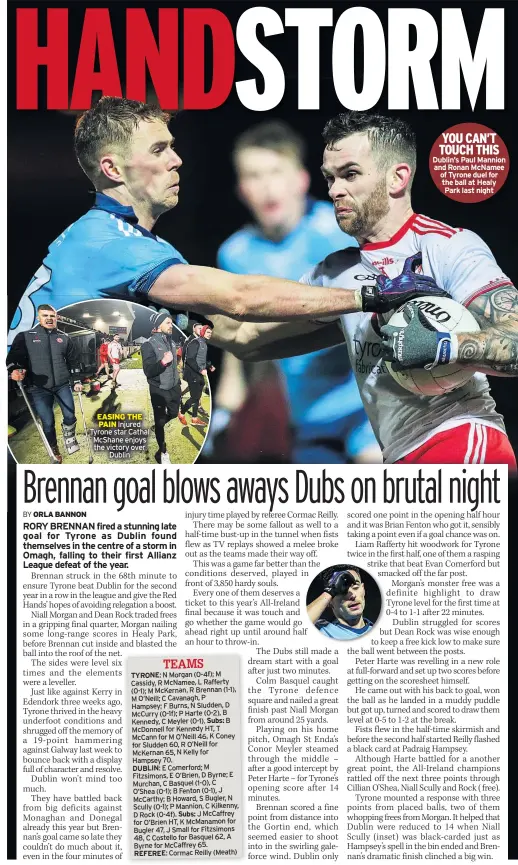  ??  ?? EASING THE PAIN Injured Tyrone star Cathal McShane enjoys the victory over Dublin
YOU CAN’T TOUCH THIS Dublin’s Paul Mannion and Ronan McNamee of Tyrone duel for the ball at Healy Park last night