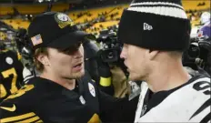  ?? Associated Press ?? Steelers quarterbac­k Kenny Pickett, left, greets Bengals quarterbac­k Joe Burrow after the game Sunday at Acrisure Stadium. The Bengals won, 37-30.