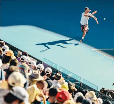  ?? Photo: AFP ?? Stefanos Tsitsipas hits a return against Russia’s Karen Khachanov during their singles semi-final at the Australian Open yesterday.