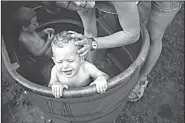  ??  ?? “Our Natural State Exhibit of Photograph­y” at Arts Center of the Ozarks in Springdale includes Swimming Hole (top left) by Don
House, untitled photo by Mike Disfarmer and Don’t You Want to
Have White Babies? (left) by Donna Pinckley.