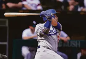  ?? Charles Rex Arbogast / Associated Press ?? The Dodgers’ Max Muncy watches his three-run homer, which came after the White Sox intentiona­lly walked Trea Turner one batter earlier. Turner was behind in the count 1-2 when Chicago manager Tony La Russa called for the walk.