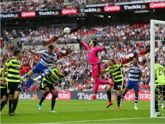  ?? (Getty) ?? Danny Ward punches clear a Reading free-kick