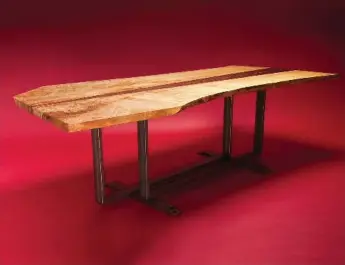  ??  ?? Cherrywood Studio makes one-of-a-kind furniture furniture from salvaged urban hardwood trees.