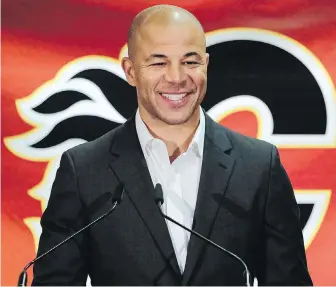  ??  ?? Former Flames captain Jarome Iginla announces his retirement at a news conference in Calgary on Monday. Iginla holds Flames records for most goals, points and games played.