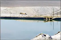  ??  ?? In this Jan 30, 2017 file photo, a truck carries away waste salt at the Silver Peak lithium mine near Tonopah, Nevada. (AP)