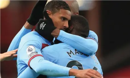  ?? Photograph: Mike Egerton/Reuters ?? Sébastien Haller is mobbed by teammates after scoring the winner for West Ham at Bramall Lane.