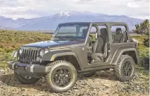  ?? CHRYSLER ?? Delivering “pure functional­ity,” the 2014 Jeep Wrangler Willys Wheeler Edition is a throwback to the wartime vehicles of the ‘40s.