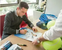  ?? Photo by Neeraj Murali ?? Roberto Bautista Agut signs autographs after interactin­g with the media in Dubai on Sunday. —