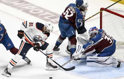  ?? Aaron Ontiveroz, The Denver Post ?? Edmonton forward Evander Kane (91) attempts to shoot on Colorado goaltender Pavel Francouz during the first period at Ball Arena on Thursday.