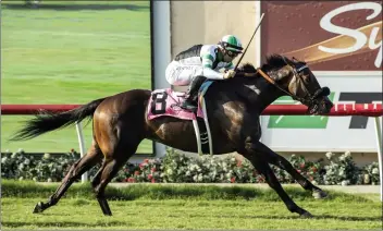  ?? BENOIT PHOTO VIA AP ?? Humberto Rispoli rides Balnikhov to a 11⁄2-length victory in the $100,000 Oceanside Stakes on Friday at Del Mar.