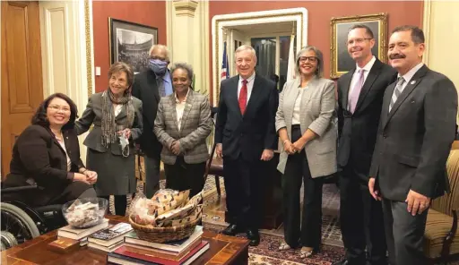  ?? LYNN SWEET/SUN-TIMES ?? Mayor Lori Lightfoot kicks off her D.C. visit with an Illinois lawmakers dinner in Sen. Dick Durbin’s Capitol office. From left, Sen. Tammy Duckworth, Rep. Jan Schakowsky, Rep. Danny Davis, Lightfoot, Durbin, Rep. Robin Kelly, Rep. Rodney Davis and Rep. Jesus “Chuy” Garcia.