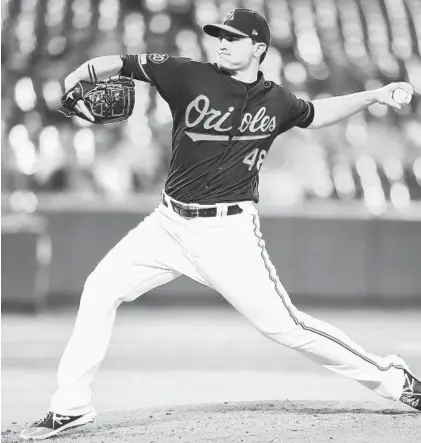  ?? MITCHELL LAYTON/GETTY PHOTOS ?? Orioles starter Richard Bleier delivers a pitch in the second inning against the Mariners on Friday night.