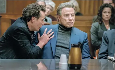  ?? Brian Douglas Lionsgate Premiere ?? CHRIS KERSON, left, as Willie Boy Johnson, an FBI informant and friend of crime boss John Gotti Sr. (John Travolta) in the film “Gotti.”