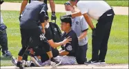  ?? Adam Hunger / Associated Press ?? Yankees pitcher Masahiro Tanaka is tended to by medical personnel after being hit by a line drive off the bat of teammate Giancarlo Stanton during a July 4 workout in New York.