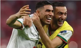  ?? Photograph: Hannah McKay/Reuters ?? Morocco’s Achraf Hakimi and Hakim Ziyech celebrate qualifying for the knockout stage.