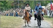  ?? Blake silvers, File ?? A Confederat­e unit moves between sutler’s row ahead of the 2022 Resaca reenactmen­t.