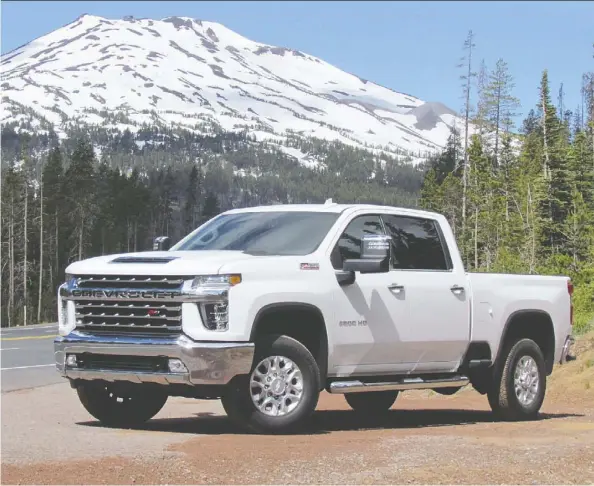  ??  ?? The 2020 Chevy Silverado HD lives up to its manufactur­er’s hype as a powerful hauler with a smooth ride.
Costa Mouzouris