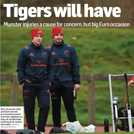  ?? DIARMUID GREENE/SPORTSFILE ?? Rory Scannell (left) and Sam Arnold are forced to watch from the sidelines as they sit out Munster training at UL earlier this week