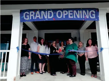  ?? RICHARD BURKHART/SAVANNAH MORNING NEWS ?? Officials cut the ribbon during the grand reopening of the Bryan County Public Library on Wednesday in Richmond Hill.