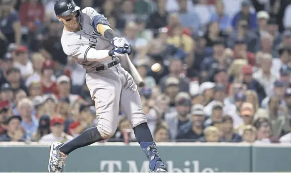  ?? ?? ↑ Aaron Judge, of the New York Yankees, hits a home run, or ‘homer’, against the Boston Red Sox