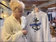  ?? PHOTOS BY GINA JOSEPH — THE MACOMB DAILY ?? Patty Romanelli, 71, founder and president of Glitz4You displays a sweatshirt she designed for boaters in Macomb and Oakland counties. When other embroidery and screen printing shops closed down during COVID-19her business boomed.