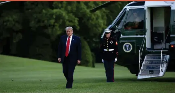  ??  ?? US President Donald Trump arrives at the White House over the weekend