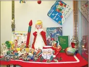  ?? FILE PHOTO ?? A small portion of Mike Lewis’ vast Christmas decoration and memorabili­a collection, seen at the Oneida Public Library in 2014
