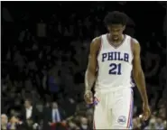  ?? MATT SLOCUM — THE ASSOCIATED PRESS FILE ?? 76ers’ Joel Embiid’s season is over because of continued issues with his left knee, the 76ers announced Wednesday.