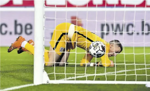  ?? (Photo: AFP) ?? LEUVEN, Belgium — England’s goalkeeper Jordan Pickford fails to stop a free kick taken by Belgium’s Dries Mertens (not pictured) during the UEFA Nations League football match between both teams at Den Dreef stadium in Louvain yesterday.