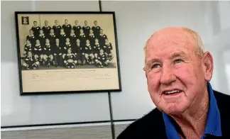  ?? PHOTO: MYTCHALL BRANSGROVE/STUFF ?? Tom Lister pictured last year with an All Blacks team photo from his playing days.