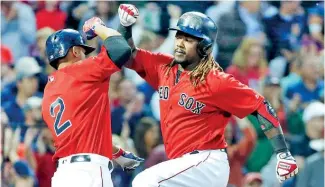  ?? AP ?? Hanley Ramírez anota una carrera ayer para los Medias Rojas. Se fue de 4-2 anoche.