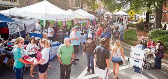  ?? CONTRIBUTE­D BY RYAN MYERS ?? Live music, barbecue pitmasters and classic cars invade downtown Milledgevi­lle for the annual Deep Roots Festival.