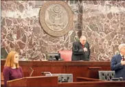  ?? File ?? Senior U.S. District Judge Harold L. Murphy puts his hand over his heart as the American flag is brought in by the Dobbins Air Force Honor Guard during a Naturaliza­tion Ceremony in 2019.