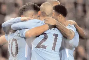  ?? AP ?? Manchester City’s Sergio Aguero (left) celebrates with teammates after scoring his second goal, his side’s third, during the English Premier League match at Etihad stadium, in Manchester, England, yesterday. Man City won 4-0.