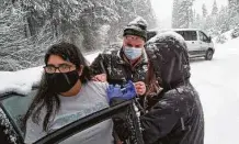  ?? Josephine County Public Health Department ?? An impromptu roadside COVID-19 vaccinatio­n takes place in rural southern Oregon during a snowstorm.