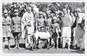  ?? LALIT GOPAL / HT ARCHIVE ?? ■ A goat called Ravi was presented by the Pathans of Mardan (now in Pakistan) to Gandhi during his visit, May 1938. Khan Abdul Ghaffar Khan (left) and Mahadev Desai (right) are in the frame.