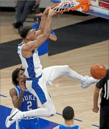  ??  ?? Au’Diese Toney dunks against Duke in the second half.