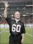  ?? JOHN AMIS — THE ASSOCIATED PRESS FILE ?? Former Atlanta Falcons Pro Bowler Tommy Nobis is introduced along with other members of the 1966 inaugural team during halftime of an NFL football game against the Carolina Panthers in Atlanta. Nobis, a hard-hitting linebacker for Atlanta and the University of Texas who earned the nickname “Mr. Falcon,” had the most severe form of chronic traumatic encephalop­athy. And now, as Atlanta prepares to host the Super Bowl, the descent of the NFL upon their hometown is a reminder for his family of the impact, both good and bad, that football has had on them.