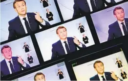  ?? CHRISTOPHE ARCHAMBAUL­T GETTY IMAGES ?? Screens display French President Emmanuel Macron as he imposes a curfew of 9 p.m. to 6 a.m. in the Paris region and eight other metropolit­an areas.