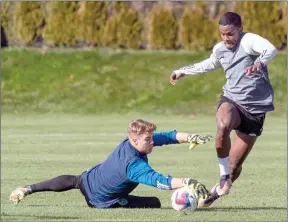  ?? The Canadian Press ?? Vancouver Whitecaps FC’s Sergio Cordova (right) tries to score a goal during the team’s practice in Vancouver, Tuesday.