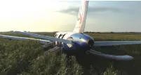  ?? (Reuters) ?? A VIEW SHOWS the Ural Airlines Airbus 321 passenger plane following an emergency landing yesterday in a field near Zhukovsky Internatio­nal Airport in Moscow.