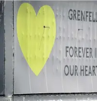  ?? PHoTo: VICToRIA JoNES/ PA WIRE ?? A banner with a green heart on it is now wrapped around the tower block