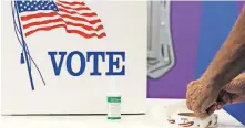  ?? [DOUG HOKE/ THE OKLAHOMAN] ?? Voting at Precinct 61 in Edmond, Aug. 25.