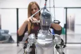  ?? ASSOCIATED PRESS ?? AI engineer Jenna Reher works on humanoid robot Figure 01 at Figure AI’s test facility in Sunnyvale, Calif. in 2023. ChatGPT-maker OpenAI is looking to fuse its artificial intelligen­ce systems into the bodies of humanoid robots as part of a new deal with robotics startup Figure.