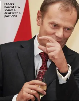  ??  ?? Cheers: Donald Tusk shares a drink with a politician