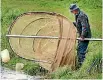  ?? JOHN HAWKINS/FAIRFAX NZ ?? A fisherman checking his whitebait net on the banks of the Waihopai River.